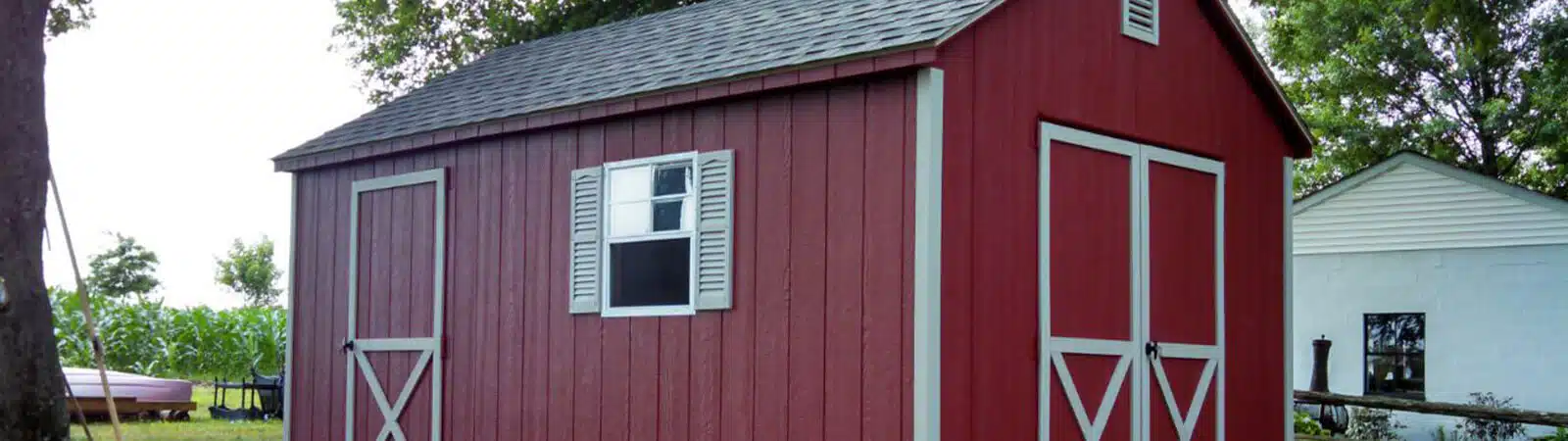 Red and white backyard shed from Montco Fence