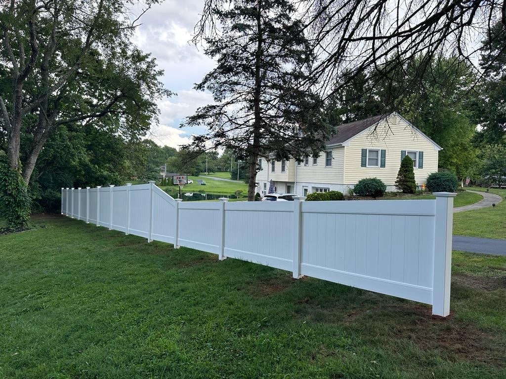 Step-by-step instructions on how to install vinyl fence in a backyard