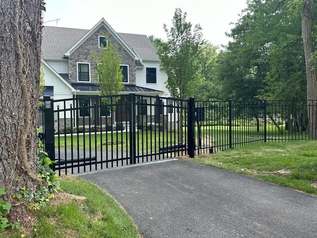 A modern fence gate design made of steel and wood panels for enhanced privacy and security.