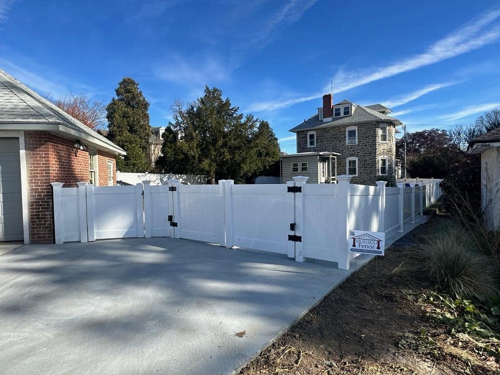 A modern fence gate design made of steel and wood panels for enhanced privacy and security.